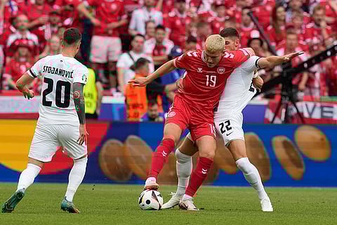 Jonas Wind is challenged by Slovenia players